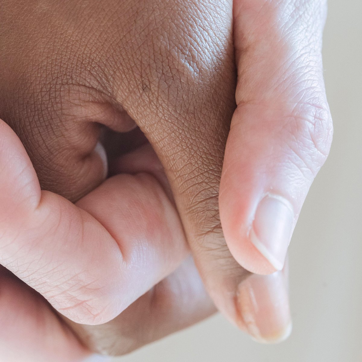 An image of a couple holding hands